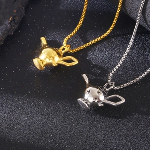 Detail of creative gold and silver trophy pendants with polished steel finish on black