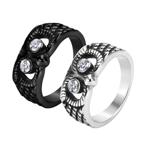 Vintage owl rings in black and silver finishes featuring feather textures and crystals