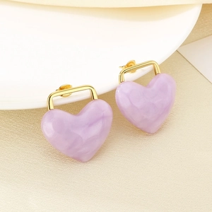 Close-up of heart-shaped purple marble resin earrings with 18K gold plated metal