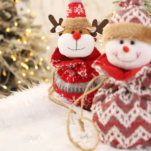 3D knitted Christmas reindeer and snowman drawstring bags with festive ornaments