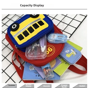 Interior view of bus-shaped toddler backpack showing large storage capacity for stationery
