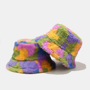 Close-up of thick plush bucket hat showing colorful faux fur texture and stitching