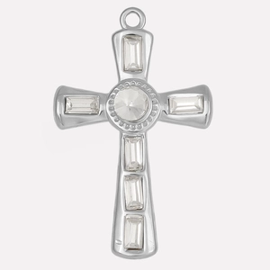 Macro detail of silver stainless steel cross pendant with zircon stones on white background