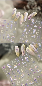 Detail of unicorn nail stickers featuring pastel rainbows and dreamy stars on nails