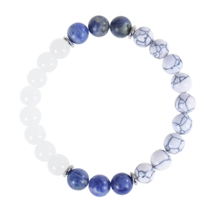 Sodalite and white turquoise beaded bracelet with silver spacers on white background