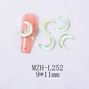 Close-up of 9x11mm moon-shaped light green iridescent resin nail art charms