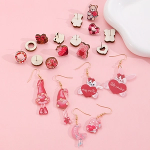Flat lay detail of Valentine acrylic and wooden earrings with hearts and bears