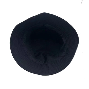 Detailed top view of a black reversible bucket hat showing inner lining and brim stitching