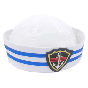 Detail of white sailor hat with blue stripes and embroidered nautical anchor badge