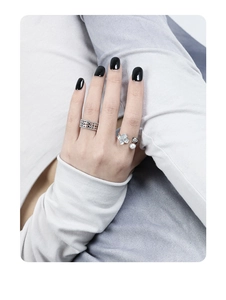 Close-up of S925 silver ring featuring micro-set zircon flowers and elegant pearls