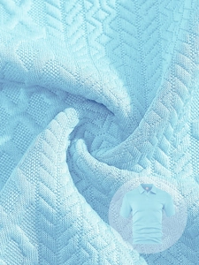 Macro detail of light blue textured knit fabric on a men's polo shirt with diamond pattern