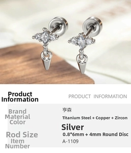 Macro shot of silver spike ear stud featuring zircon inlay and stainless steel screw back
