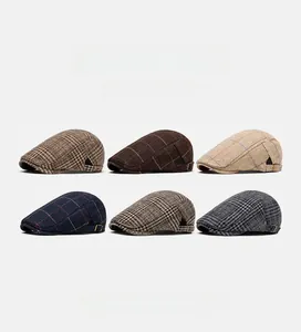 Detailed grid showing six plaid and herringbone newsboy caps with metal buckle details