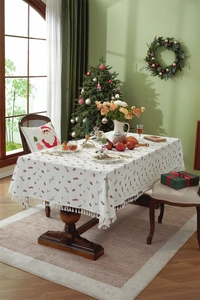 Detail view of cotton Christmas tablecloth with red berry embroidery and fringe edge