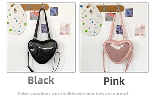 Detailed comparison of heart-shaped ita bags in black and pink with transparent windows