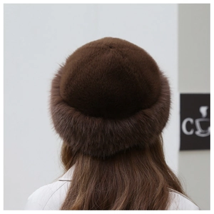 Detail of dark brown faux fur hat showing plush texture and warm ear protection design