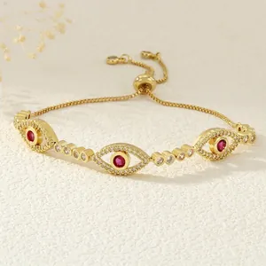 Detail of gold evil eye bracelet with purple zircons and adjustable slider box chain