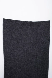 Detailed close-up showing texture of dark grey diamond knit cardigan fabric and belt