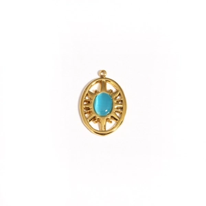 Close-up of golden sunflower pendant with blue oval opal stone inlay and starburst detail