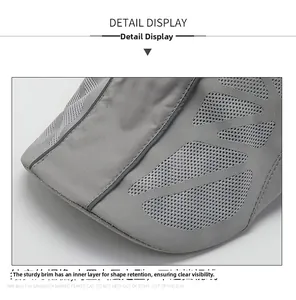 Detail view of breathable gray mesh fabric and structured brim on a sport cap