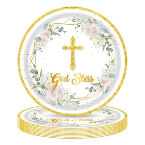 Macro shot of stacked baptism plates featuring a golden cross and floral wreath design