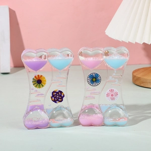 Double heart-shaped liquid motion bubbler with rotating sunflower and colorful oil drops