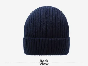 Detail view of the back of a navy rib-knit winter beanie with thick thermal texture