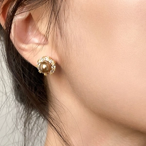 Elegant champagne pearl stud earrings with zircon halo inlay in vintage golden finish