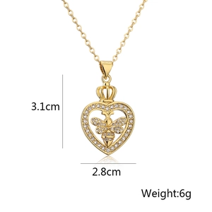 Detail view of gold heart crown bee necklace with measurements 3.1cm high and 2.8cm wide