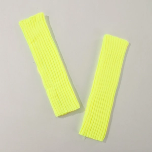 Neon yellow-green ribbed knitted arm warmers in a medium-long fingerless sleeve style