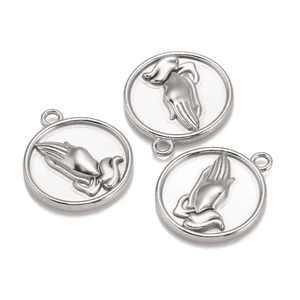 Close-up of three silver stainless steel round pendants with embossed praying hands design