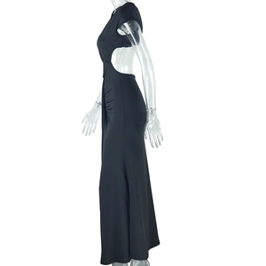 Detailed side view of black sleeveless long dress featuring elegant waist cut-out design