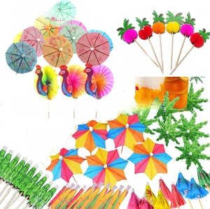 Close-up of tropical fruit picks featuring paper pineapple and flamingo honeycomb designs