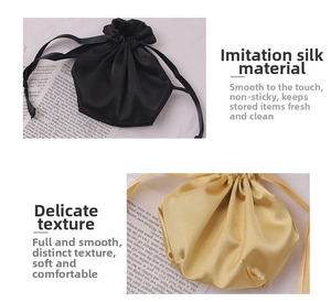 Detail of black and champagne satin drawstring bags with smooth faux silk texture
