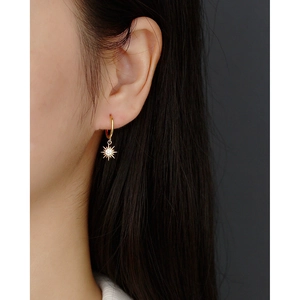 S925 sterling silver gold huggie hoop earrings featuring a sparkling sunburst charm