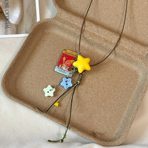 Creative acrylic star and book pendant necklace with brown cord for a vacation style look