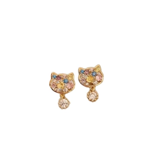 Cat ear studs with colorful zircon stones in gold-plated setting on white background