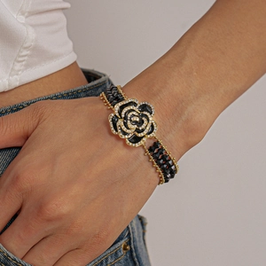 Macro view of a black rose bracelet with crystal accents and double-strand beads