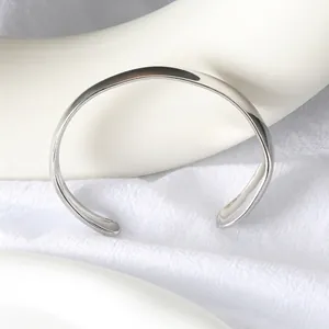 Minimalist silver stainless steel open C-shape cuff bracelet with a polished mirror finish