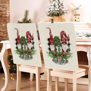 Detail of Christmas gnome chair covers with Merry Everything text on beige linen fabric