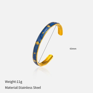 Detail shot of blue enamel star bangle in 18K gold plated stainless steel, 60mm diameter