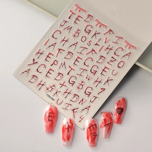 Halloween nail art stickers featuring red blood drip alphabet letters on white nails