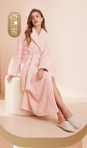Detail of soft pink thickened plush fleece bathrobe texture with tie-waist and pockets