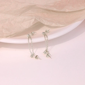 S925 sterling silver chain tassel earrings with gems on a minimalist white plate