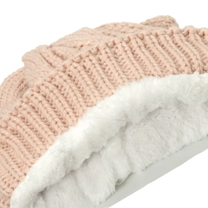 Detailed macro view of pink cable knit hat showing thick white plush fleece lining texture