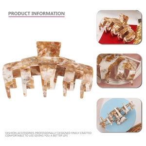 Large acetate hair claw clip with brown marble pattern and durable gold metal spring