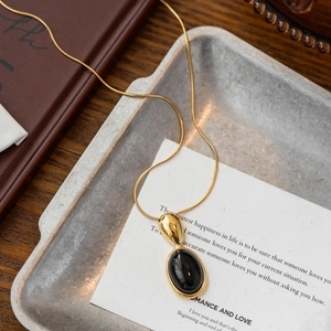 Vintage style black oval resin pendant with gold snake chain for women elegant jewelry