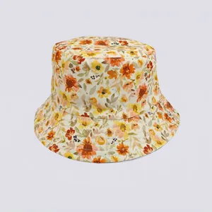 Detail of floral bucket hat with yellow and orange patterns on cotton fabric