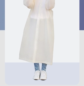 Full-length view of a semi-transparent white EVA raincoat on a model with blue jeans