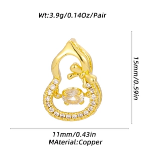 Detailed view of golden gourd-shaped copper earrings with size and weight specs
